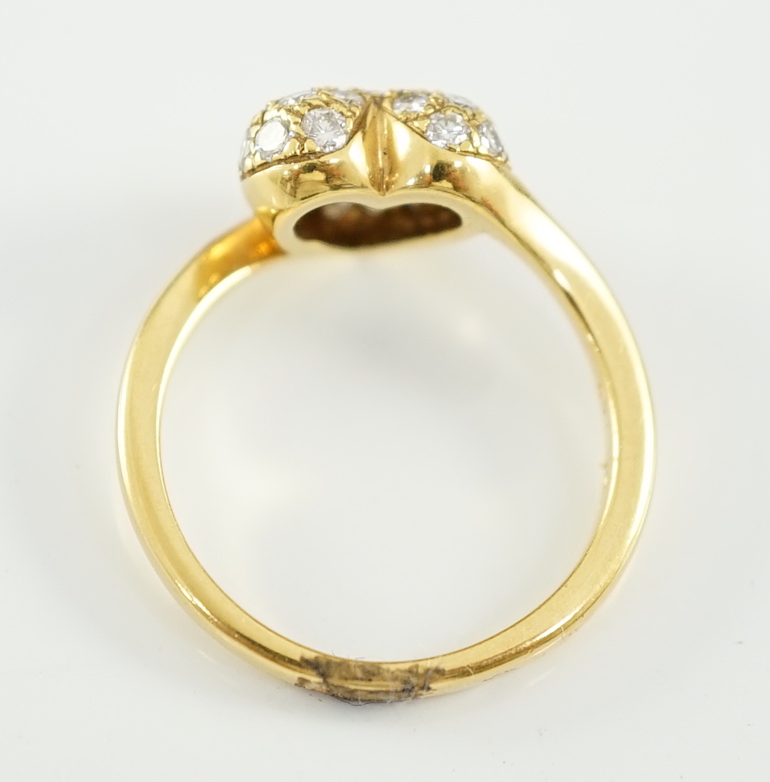 A modern Cartier 18ct gold and pave set diamond heart shaped ring